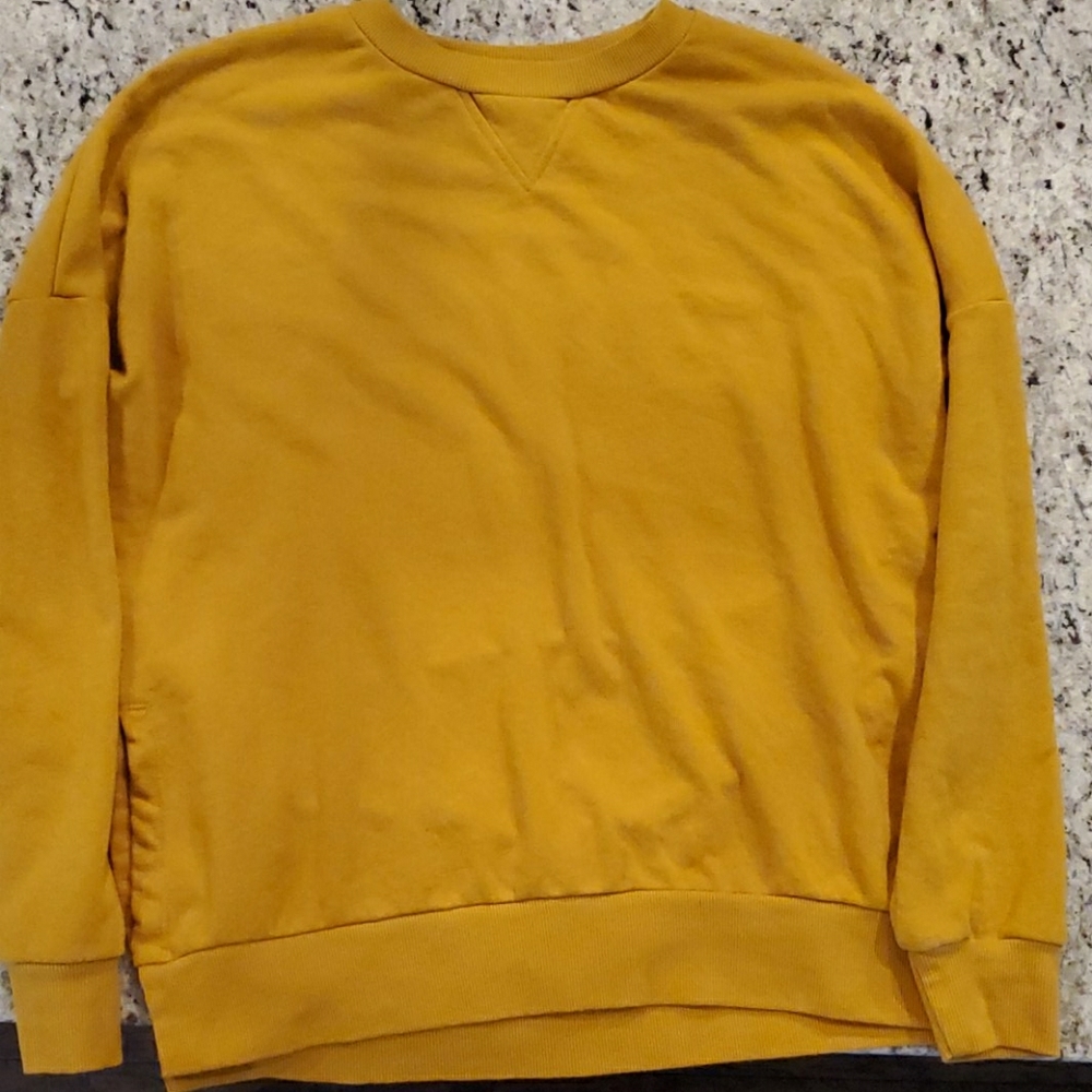 Dark yellow sweater.
